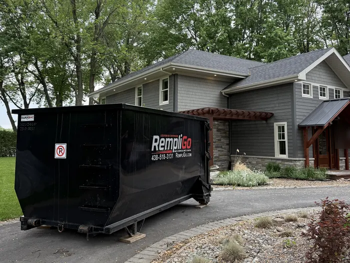 RempliGo dumpster delivered to a house with a redwood porch